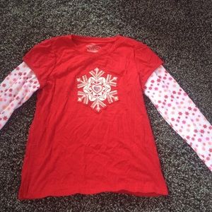 A gently used red snowflake girls shirt