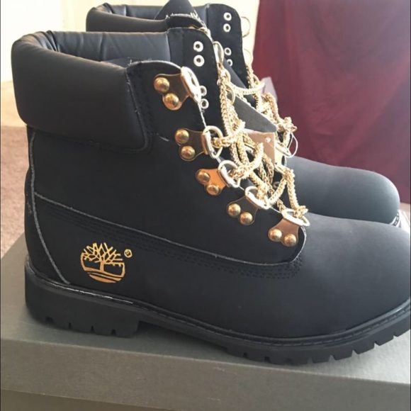 black timbs with gold chains