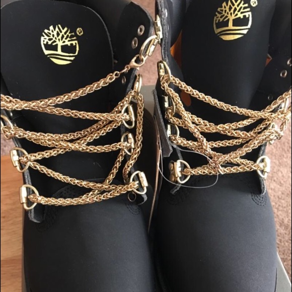 black timbs with gold chains