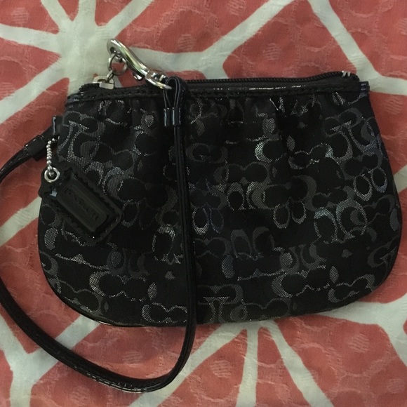 Coach patent leather and cloth signature wristlet.