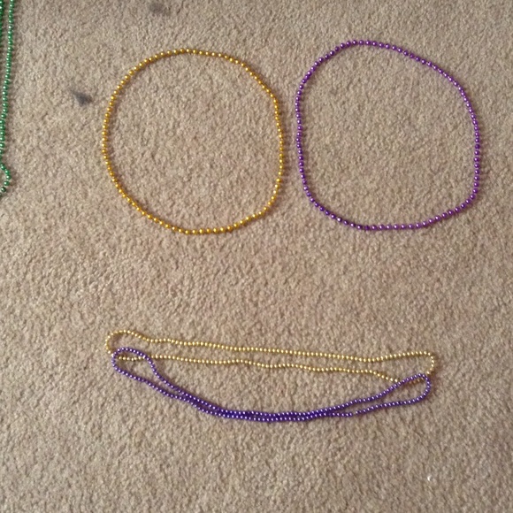 4 necklaces two gold and two purple