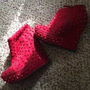 Red spiked ankle boots