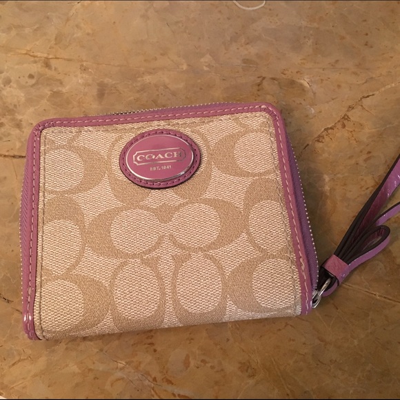Coach wristlets with pink trim