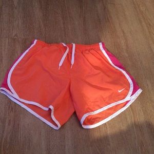 Orange and pink nike shorts
