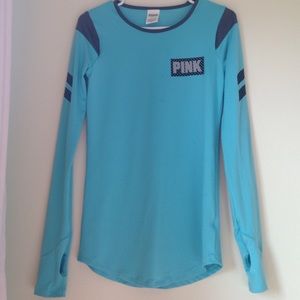 pink shirt with finger hole and logo