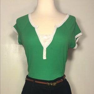 Bright green shirt with white lace trim