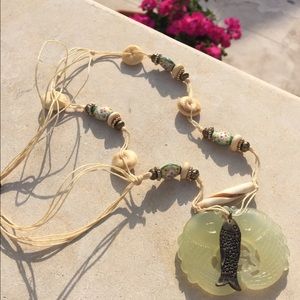 Beaded and glass fish necklace.