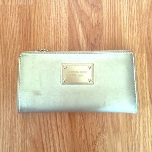 Michael Kors gold leather wallet.
