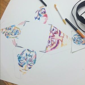 Sketch of faces done in prismacolor marker
