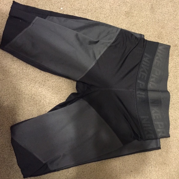 Black and gray Nike running tights.