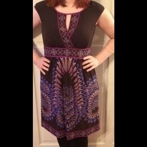 Medium knee length dress with peacock details