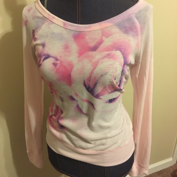 Lightweight sweater with roses and rhinestones.