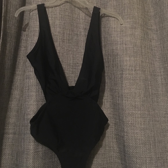 Bathing suit ***never worn**still has bikini tape
