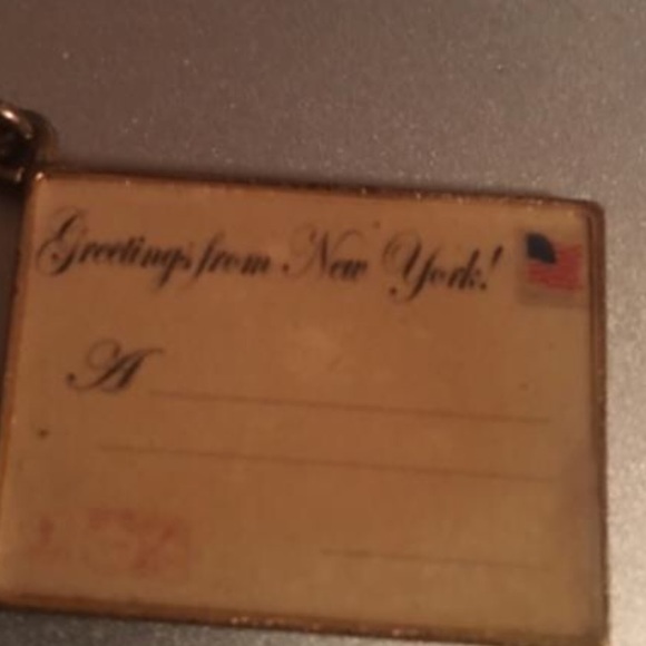 C. Wonder postcard charm