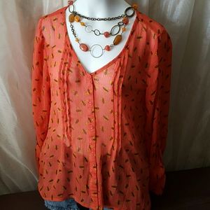 Very cute sheer blouse.