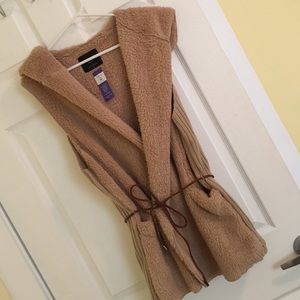 Plush teddy bear like vest.