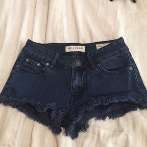Frayed blue jean shorts