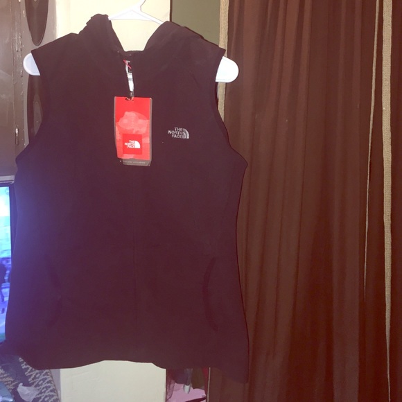 New with tags. North face vest with hood.