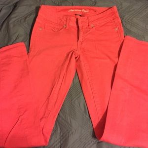 Salmon colored jeans from american eagle
