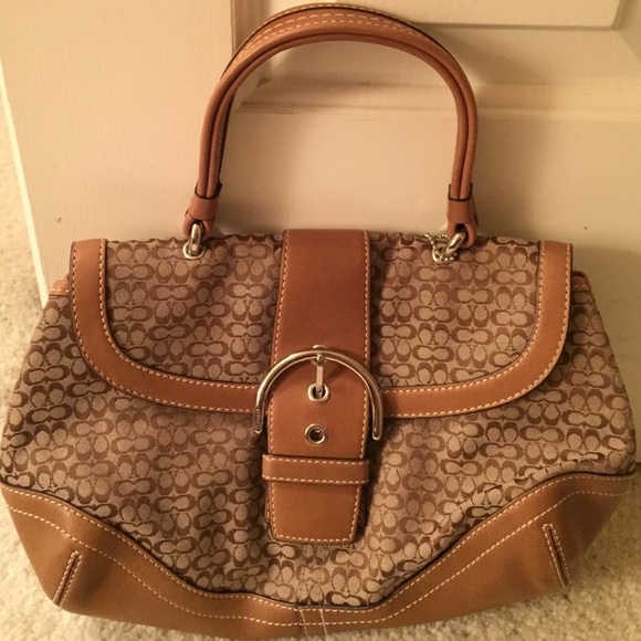 Vintage Coach front buckle purse.