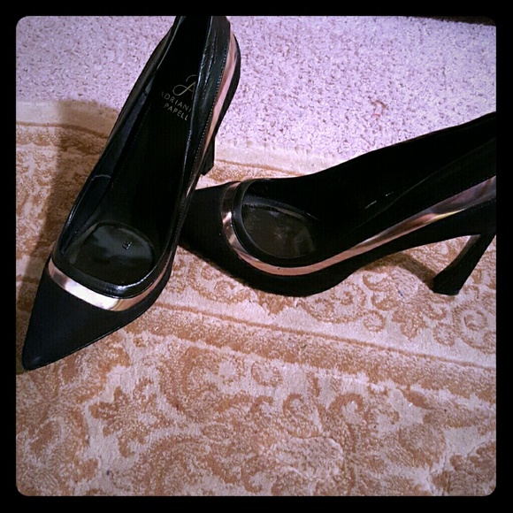 Black suede pumps with silver metallic detail.