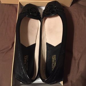 Michael Kors black on black flats