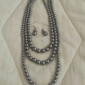 Three strand faux pearls and earrings