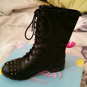 Combat boots with spikes worn once