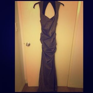 A long, form-fitted Nicole Miller dress