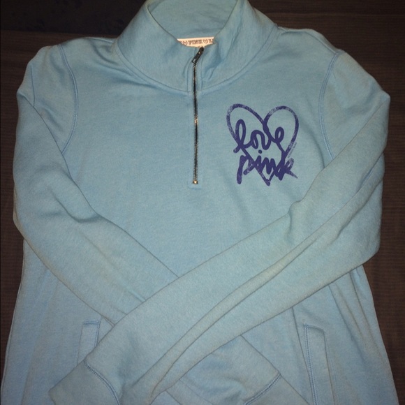 PINK: Light Blue half zip up sweater.
