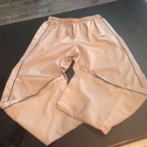 Men's Nike track pants.