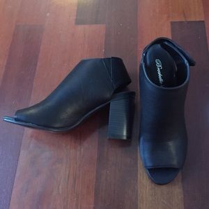 Black open toe chunky heel sandals.