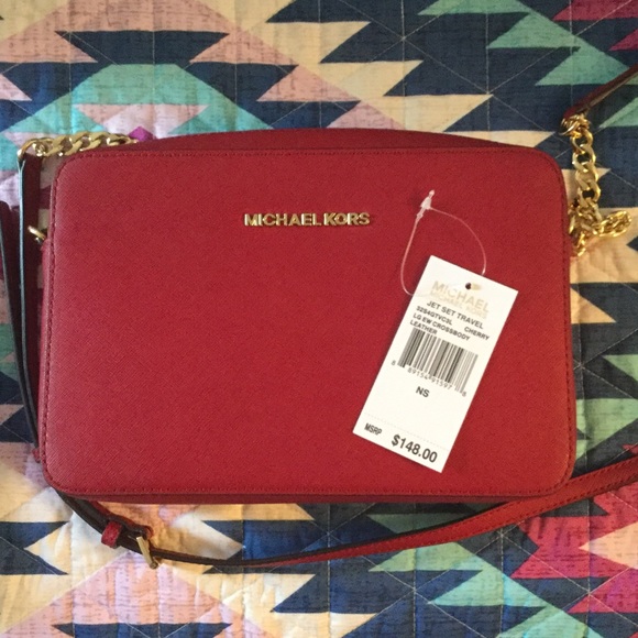 Cherry color Michael kors jet travel