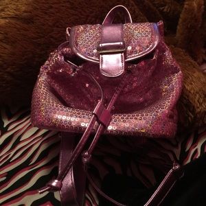 A drawstring pull mini backpack for kids:) purple