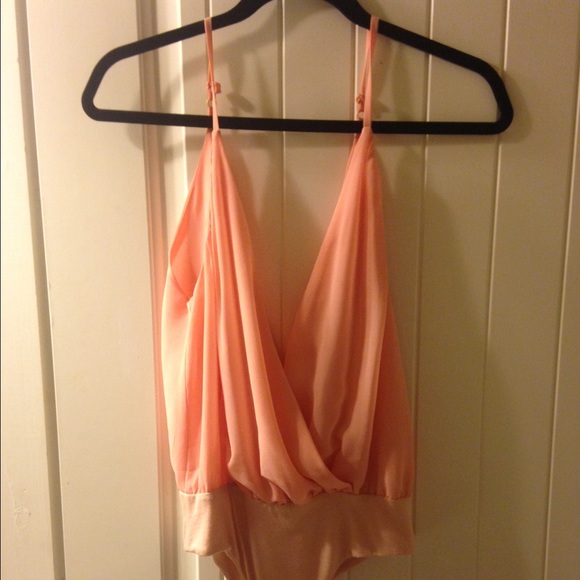 Baby pink body suit. Worn once