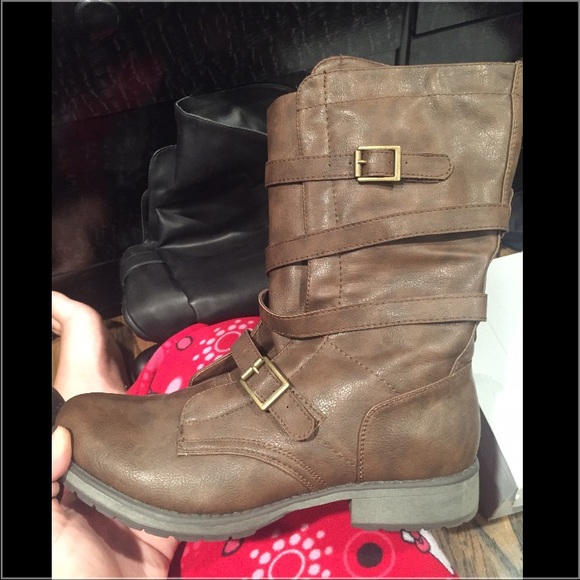 Combat boots with straps and buckles