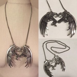 Winged heart silver necklace