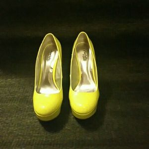 Neon yellow patent pumps