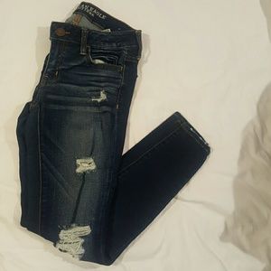 Distressed dark wash skinny jeans