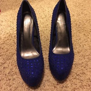 Royal blue studded pumps.