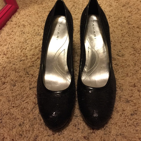 Sequenced black Tahari pumps.