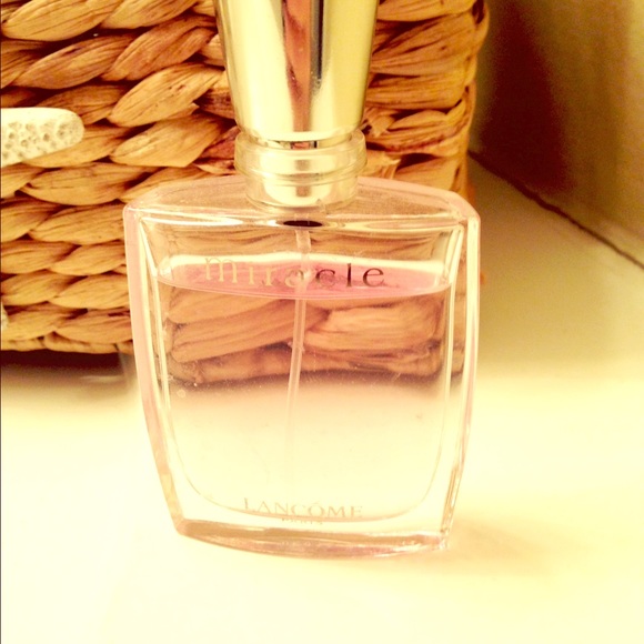 1 oz miracle by Lancôme. Barely used