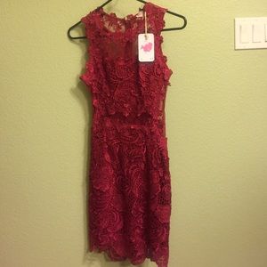 NWT Beautiful red lace dress. Sheer back.