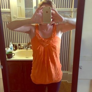 Orange floral appliqué blouson tank.