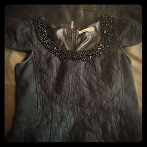 Perfect little black dress with detailed neckline