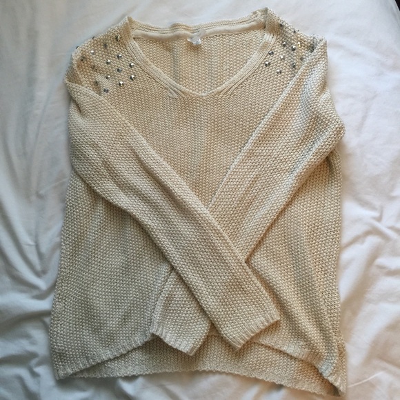 Cream sweater with studded shoulders
