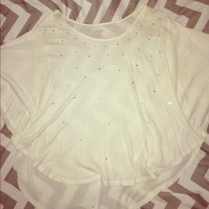 Flowing cream shirt with rhinestone details