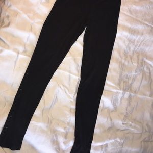 Black leggings with embellishments from knee down