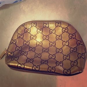 Gucci bronze cosmetic bag