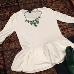 Cream colored 3/4 sleeve peplum top